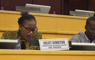 FAWE's Juliet Kimotho, Communication and Advocacy Assistant moderates the panel discussion on the education of refugees, IDPs, and returnees