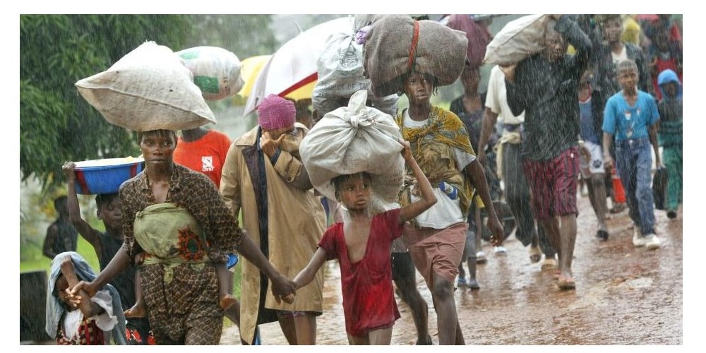 Refugees fleeing the Liberian war Image© https://qz.com/africa/1459254/liberias-civil-war-in-photos-child-soldiers-rape-then-peace/